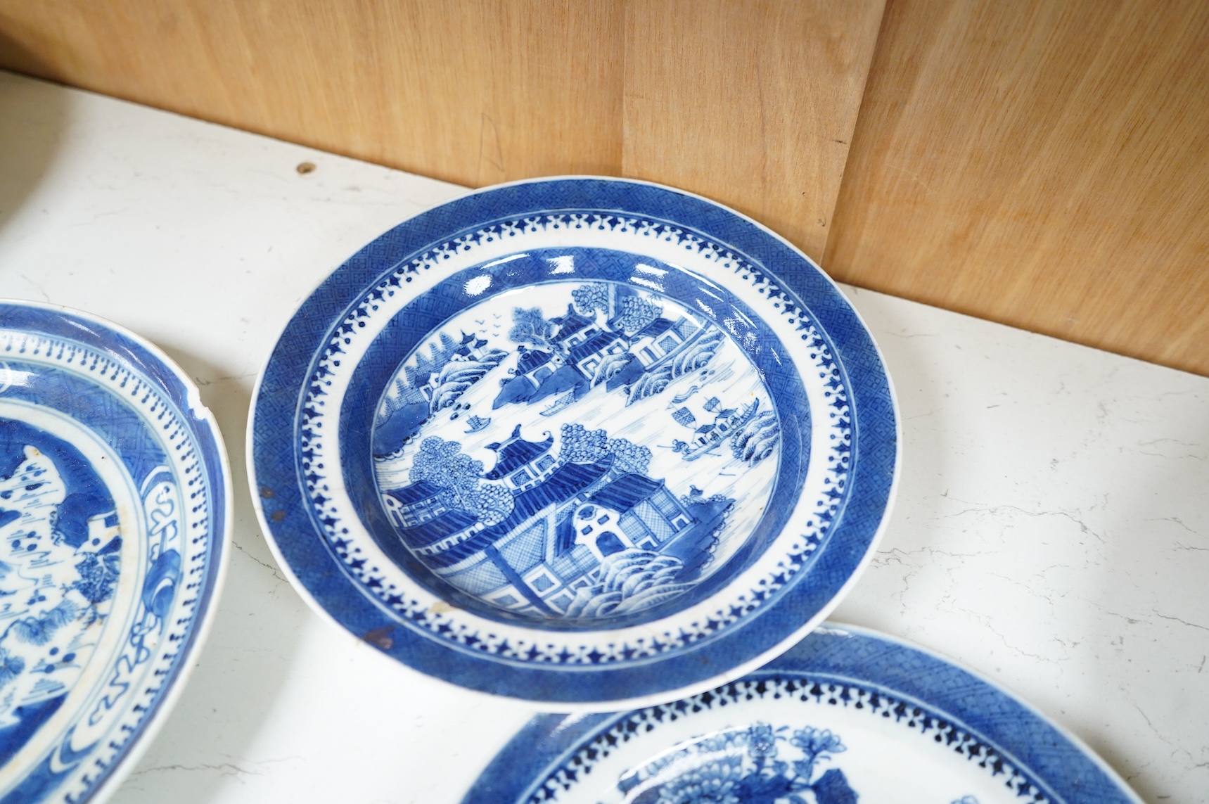 Five 18th / 19th century Chinese export blue and white plates and dishes, largest 27cm in diameter